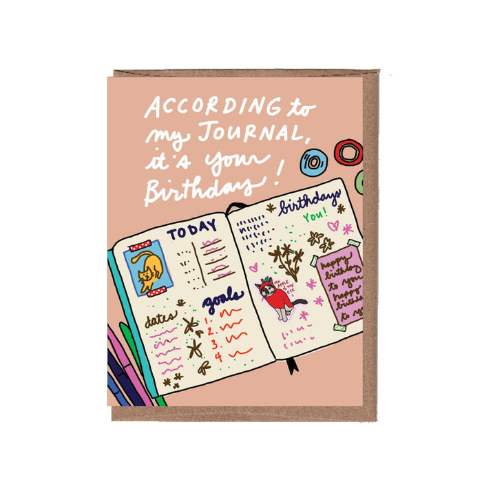 Birthday card with a journal illustration and text on a pink background